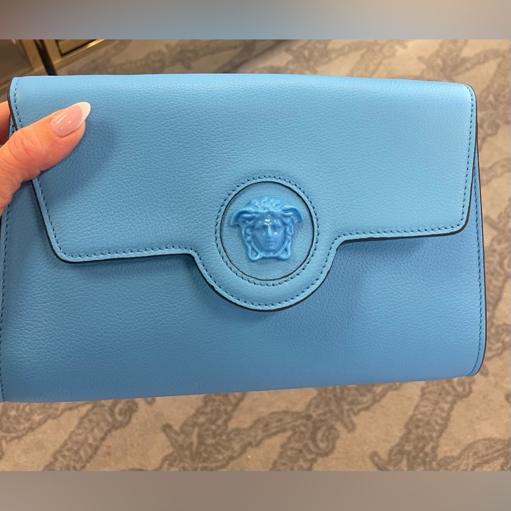 Versace blue clutch with leather handle